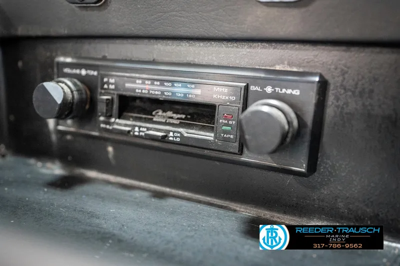 Slide: The Image of 1991 Chaparral 1800 SL dashboard radio with tuning controls and branding. - 37