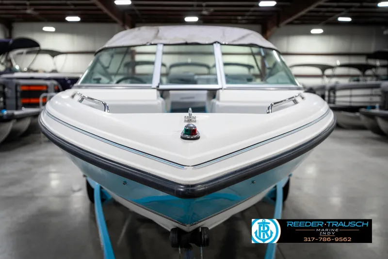 Slide: The Image of 1991 Chaparral 1800 SL boat in showroom, front view, with Reeder-Trausch logo. - 4