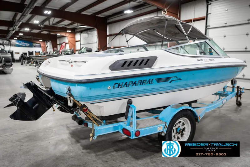 Slide: The Image of 1991 Chaparral 1800 SL boat on trailer in indoor showroom. - 7