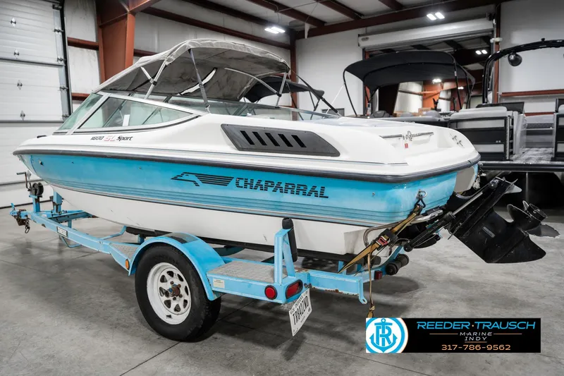 Slide: The Image of 1991 Chaparral 1800 SL boat on trailer in indoor storage facility. - 9