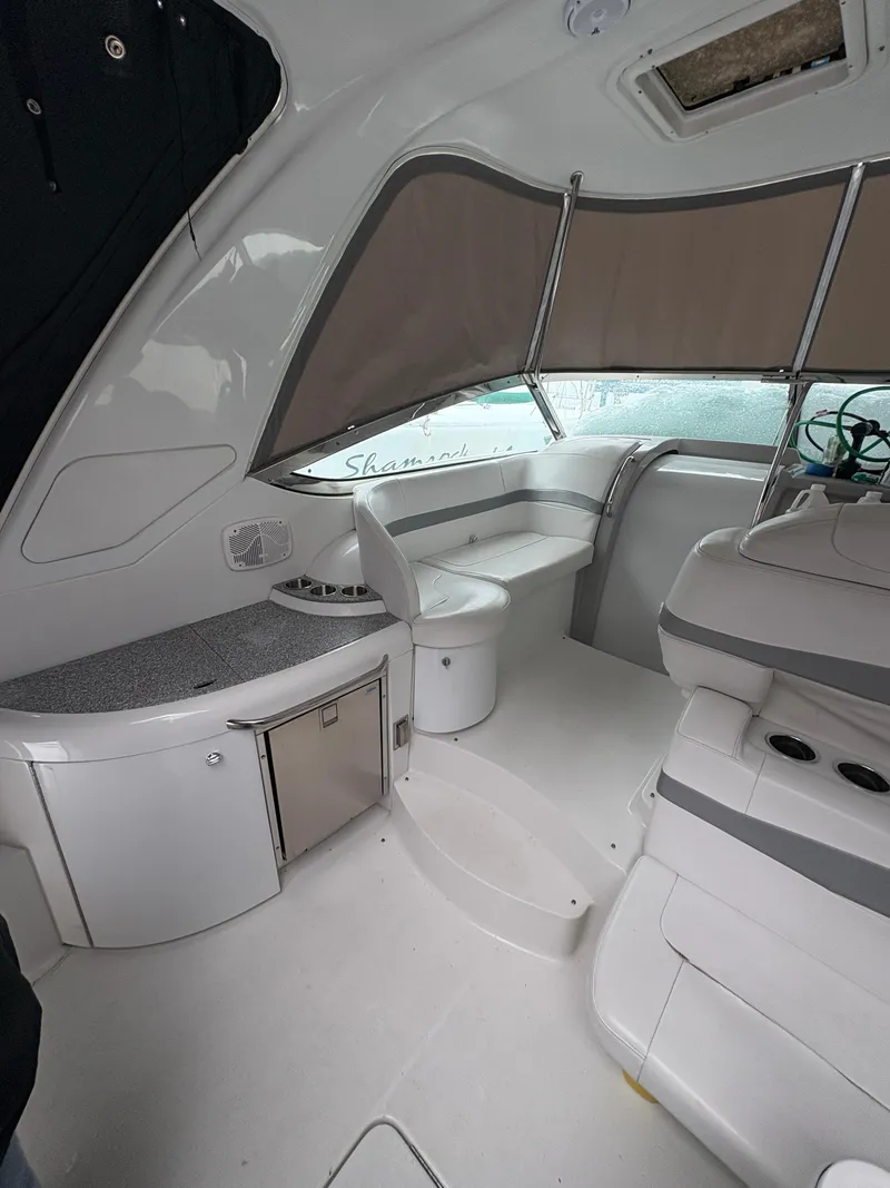 Slide: The Image of 2005 Formula 40pc boat interior with seating, counter, and helm. - 14