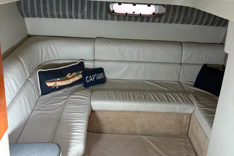 Slide: The Image of Luxurious interior of a 2005 Formula 40pc yacht with plush seating and nautical-themed pillows. - 20