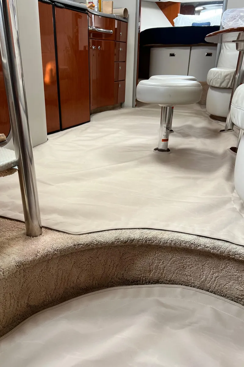 Slide: The Image of Interior of a 2005 Formula 40pc yacht, featuring sleek cabinetry and plush seating. - 21