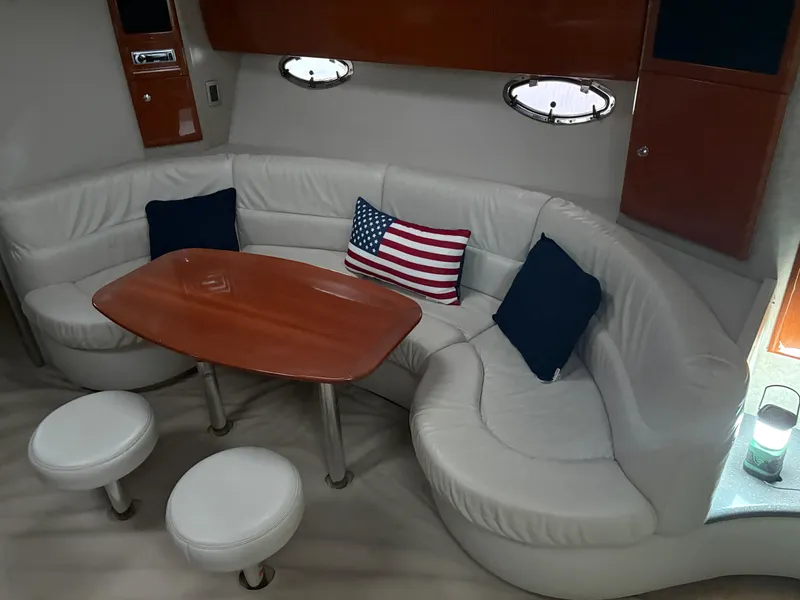 Slide: The Image of Luxurious 2005 Formula 40pc yacht interior with white leather seating and American flag pillow. - 22