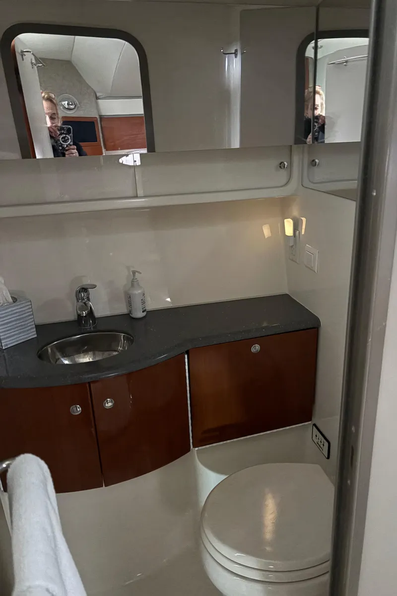 Slide: The Image of 2005 Formula 40pc yacht bathroom with sink, mirror, and storage cabinets. - 24