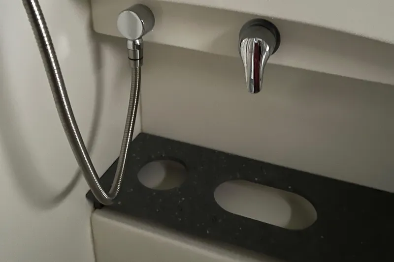 Slide: The Image of Boat bathroom sink with chrome faucet and hose, Formula 40pc, 2005 model. - 26