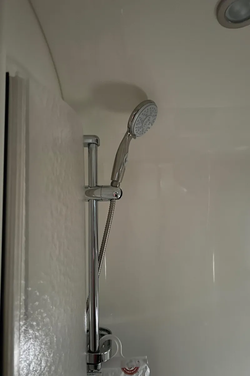 Slide: The Image of Shower area in a 2005 Formula 40pc boat with adjustable handheld showerhead. - 27