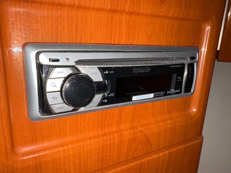 Slide: The Image of Kenwood stereo system in 2005 Formula 40pc boat, mounted on wooden panel. - 31