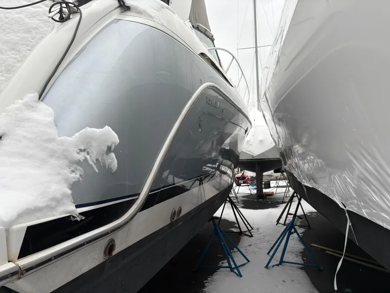 Slide: The Image of 2005 Formula 40pc boat in winter storage, covered in snow. - 33