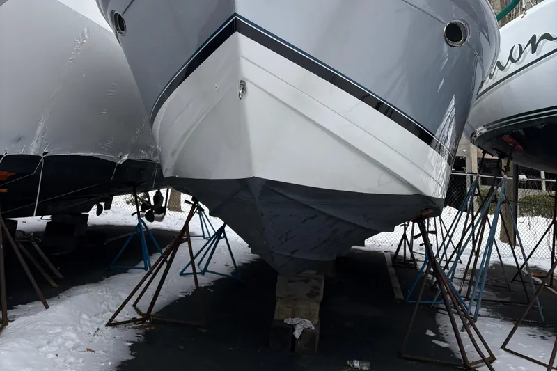 Slide: The Image of 2005 Formula 40pc boat on stands, winter storage, snow-covered ground. - 34