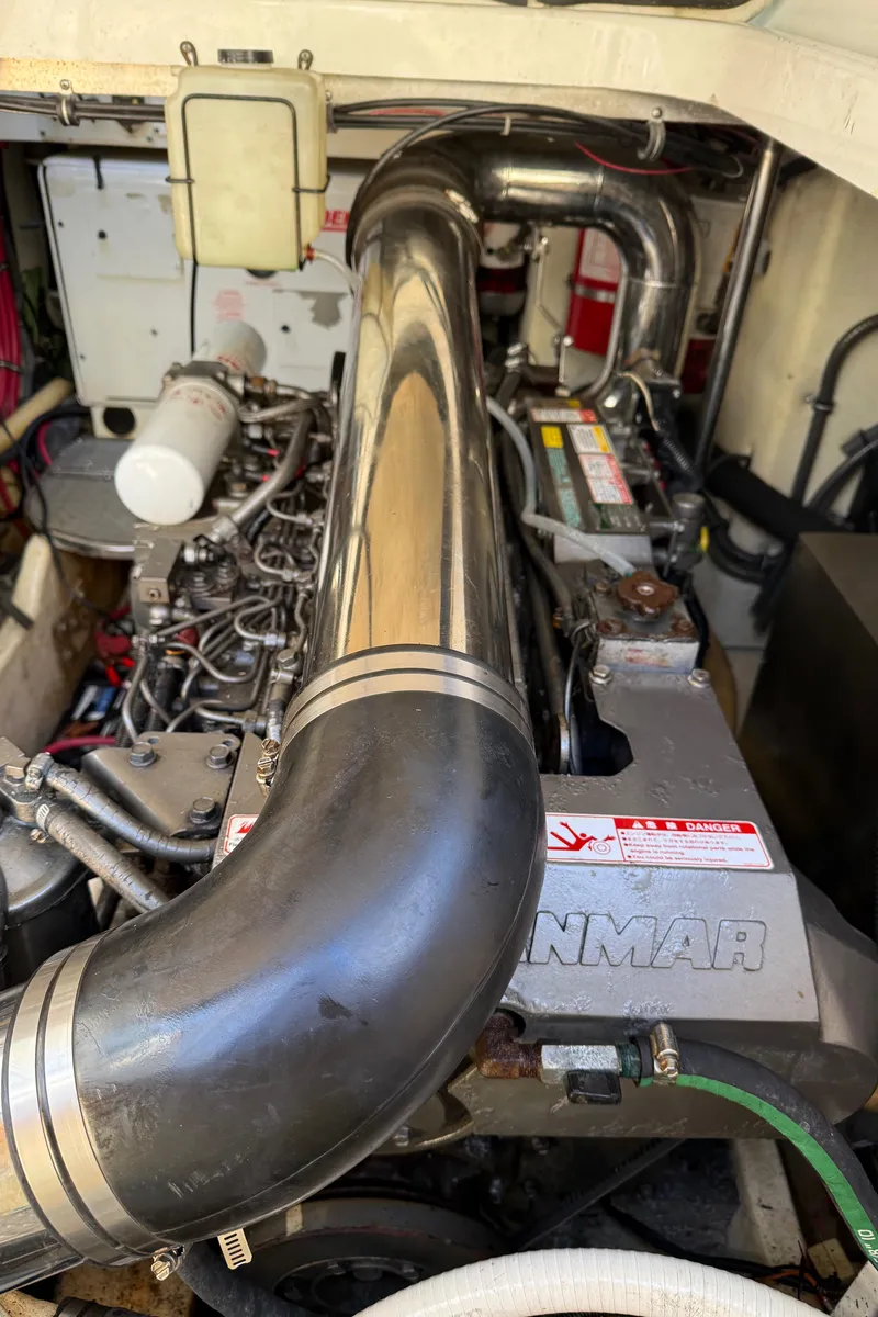 Slide: The Image of Engine compartment of a 2005 Formula 40pc boat, featuring a Yanmar engine. - 39