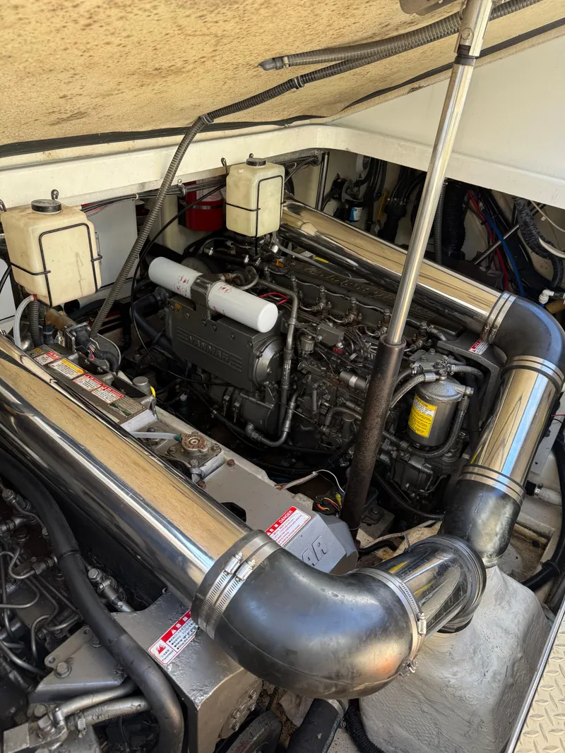 Slide: The Image of Engine compartment of a 2005 Formula 40pc boat, showcasing dual engines and components. - 41