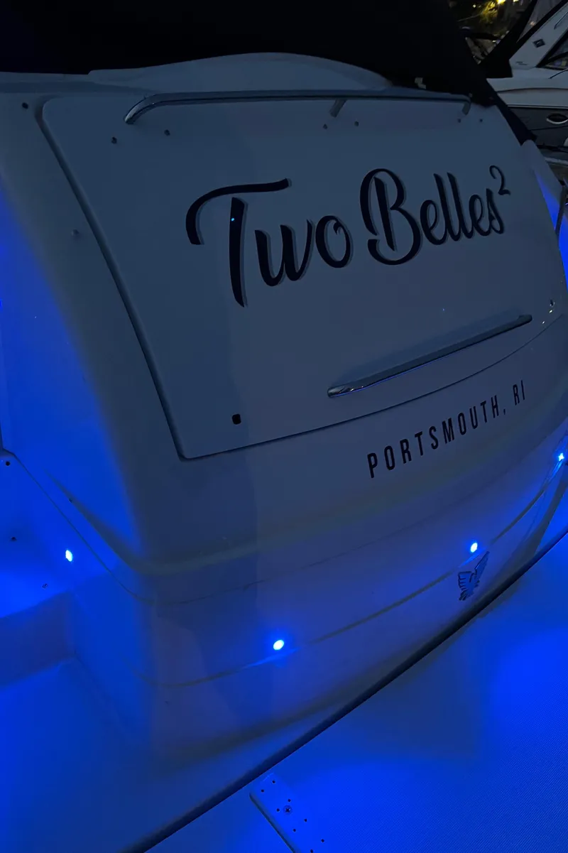 Slide: The Image of 2005 Formula 40pc boat with "Two Belles²" name, illuminated by blue lights, Portsmouth, RI. - 43