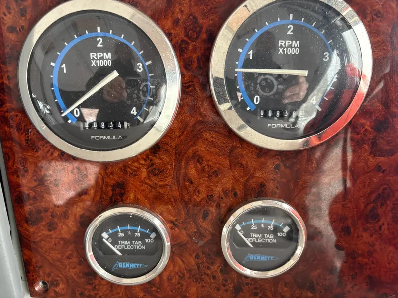 Slide: The Image of Dashboard of a 2005 Formula 40pc boat with RPM and trim gauges. - 8