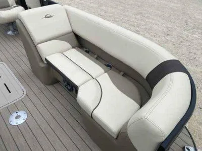 Slide: The Image of Luxurious seating on 2025 SunCatcher Select 322RC boat, featuring beige upholstery and sleek design. - 11