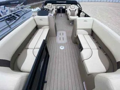 Slide: The Image of Luxurious 2025 SunCatcher Select 322RC pontoon boat interior with spacious seating and modern design. - 4
