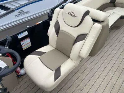 Slide: The Image of Luxurious seating on 2025 SunCatcher Select 322RC boat, featuring beige and brown upholstery. - 6