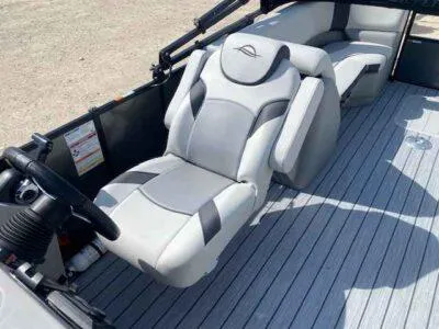 Slide: The Image of 2025 SunCatcher Select 322RC boat interior with plush seating and modern design. - 6