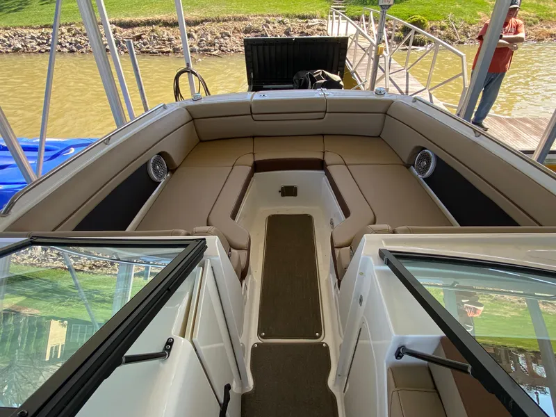 Slide: The Image of 2016 Sea Ray 270 Sundeck interior with spacious seating and open deck layout. - 4