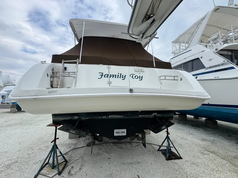 Slide: The Image of 1995 Silverton Express boat named "Family Toy" on stands, ready for maintenance. - 5