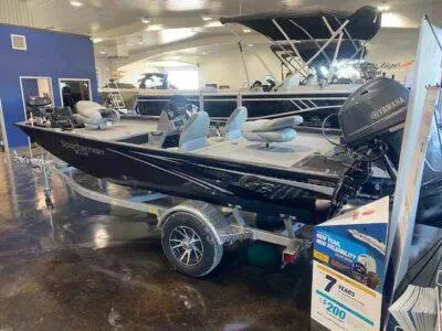 Slide: The Image of 2025 G3 Sportsman 1610 boat displayed in showroom with Yamaha engine. - 3