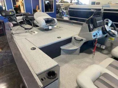 Slide: The Image of 2025 G3 Sportsman 1610 boat interior with steering console and seating. - 7