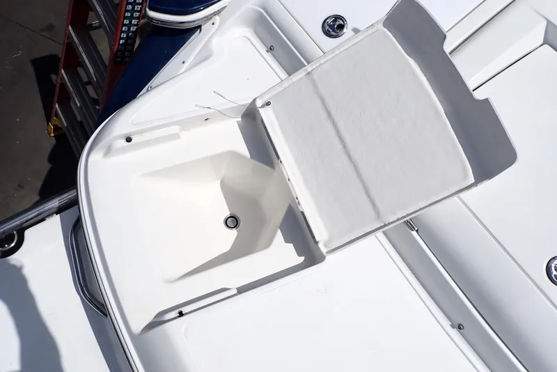 Slide: The Image of Open storage compartment on a 2002 Cobalt 240 boat deck. - 26