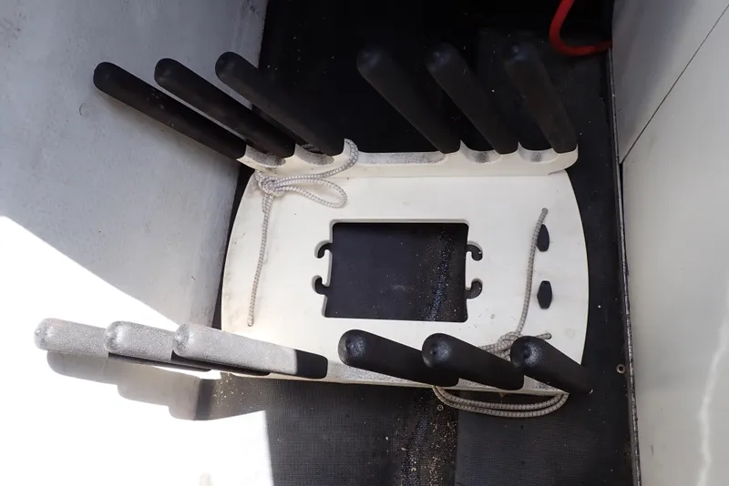 Slide: The Image of Boat storage compartment with black handles, Cobalt 240, 2002 model. - 30