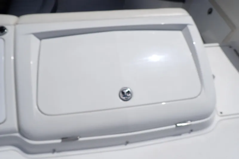 Slide: The Image of White storage compartment on a 2002 Cobalt 240 boat. - 32