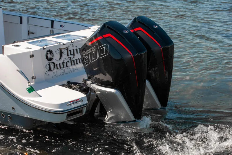 Slide: The Image of 2023 Crevalle 33 CSF boat with dual outboard engines on water. - 1