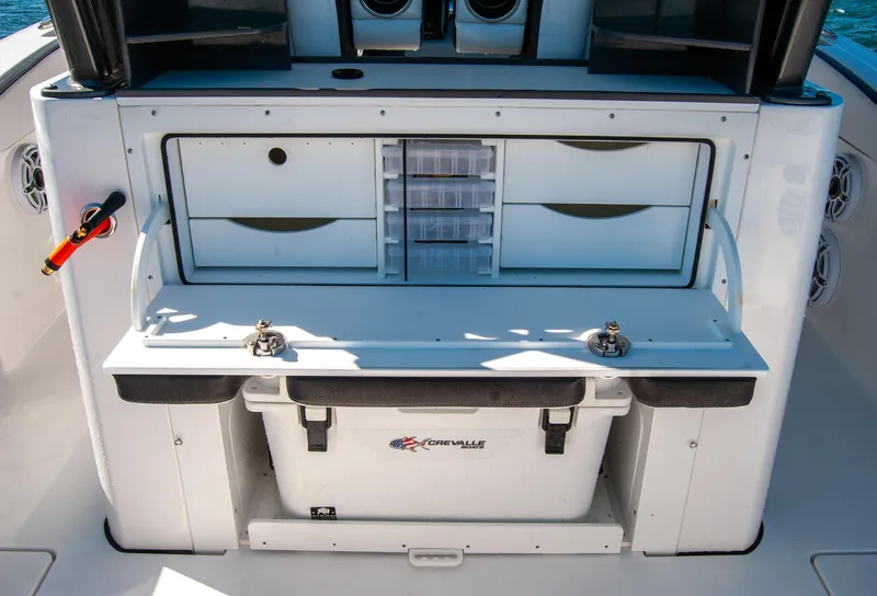 Slide: The Image of 2023 Crevalle 33 CSF boat with storage compartments and cooler on deck. - 10