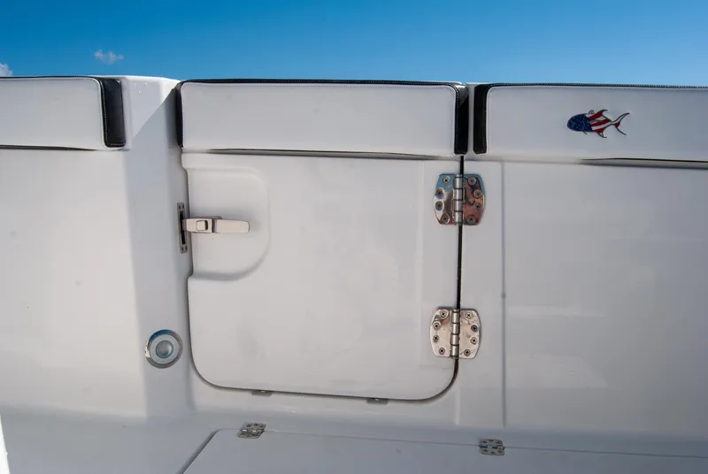 Slide: The Image of 2023 Crevalle 33 CSF boat hatch with American flag fish emblem. - 13