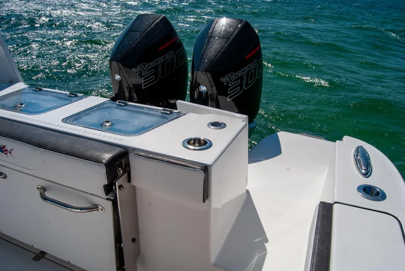 Slide: The Image of 2023 Crevalle 33 CSF boat with dual outboard engines on the ocean. - 16