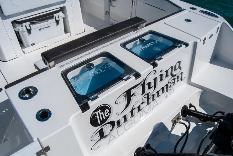 Slide: The Image of 2023 Crevalle 33 CSF boat deck with "The Flying Dutchman" branding. - 17