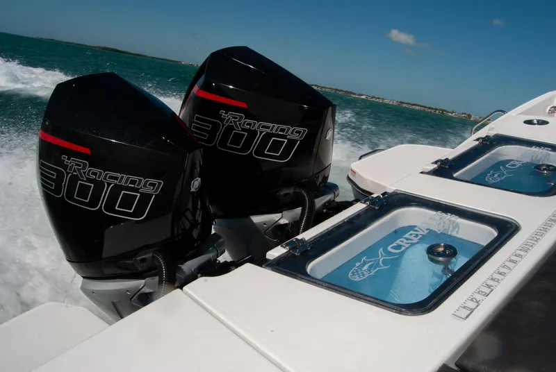 Slide: The Image of 2023 Crevalle 33 CSF boat with dual Racing 300 engines on open water. - 18