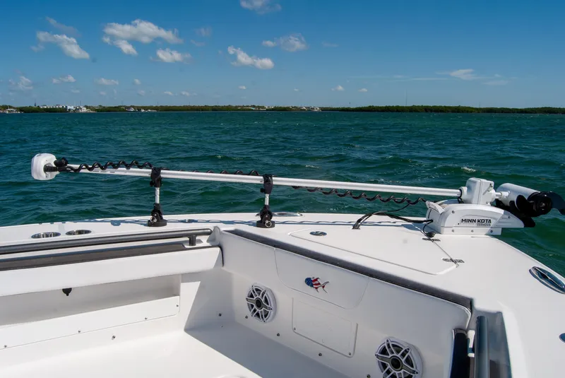 Slide: The Image of 2023 Crevalle 33 CSF boat deck with trolling motor on open water. - 21