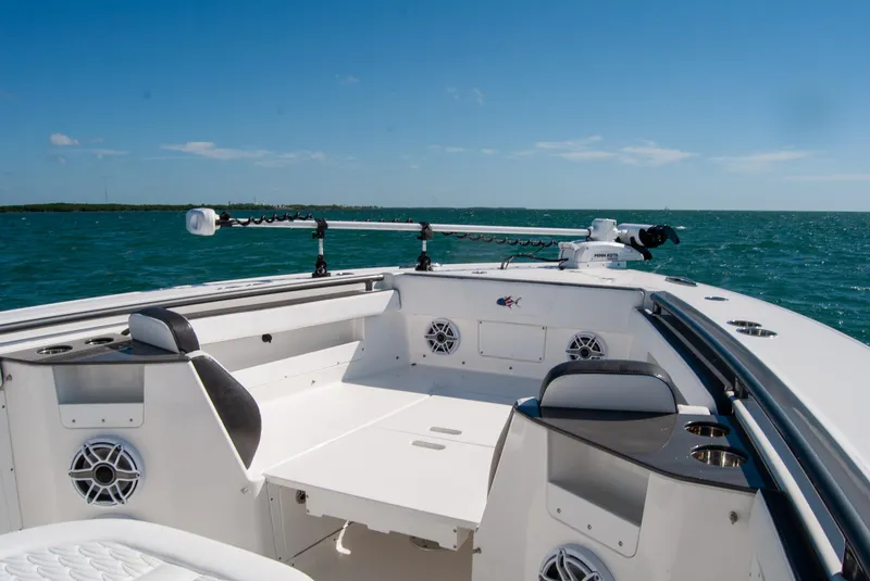 Slide: The Image of 2023 Crevalle 33 CSF boat on open water, featuring spacious seating and modern design. - 27
