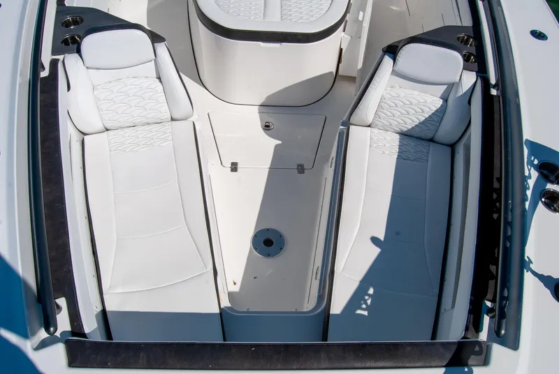 Slide: The Image of 2023 Crevalle 33 CSF boat interior with white cushioned seating. - 29