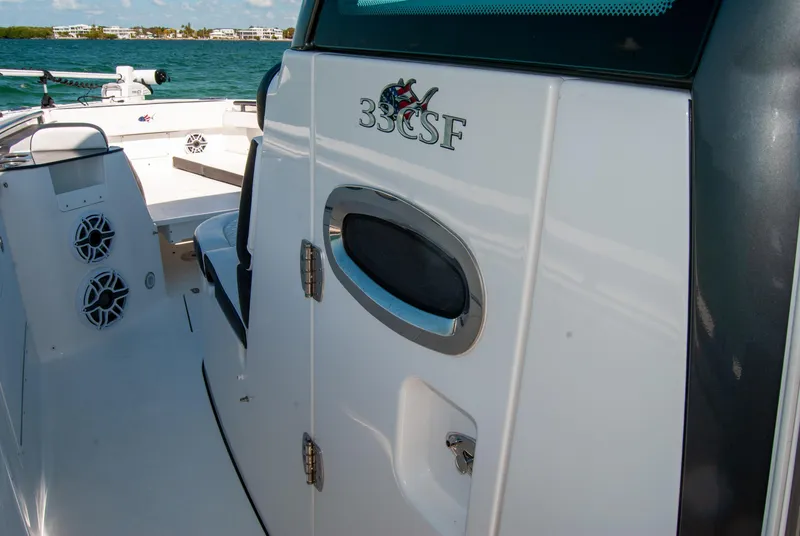 Slide: The Image of 2023 Crevalle 33 CSF boat interior with speakers and storage compartment. - 30