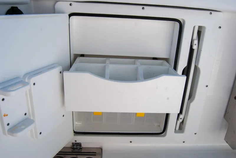 Slide: The Image of 2023 Crevalle 33 CSF boat storage compartment with open drawer. - 32