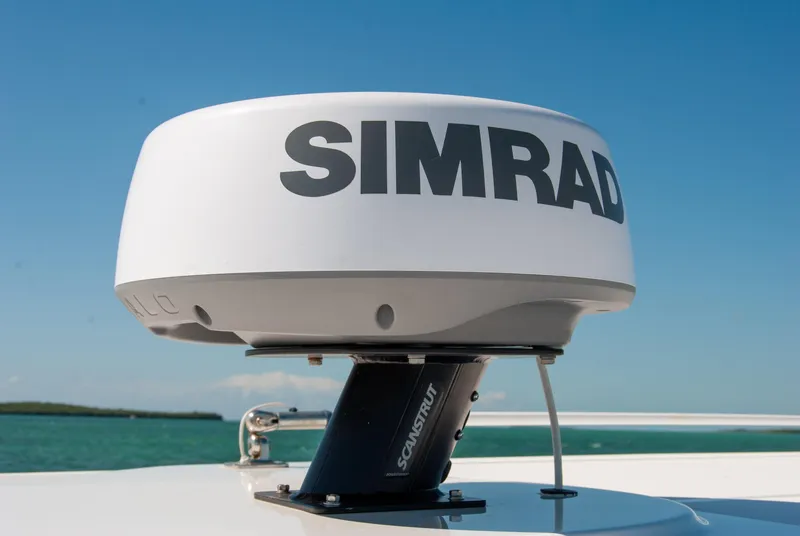Slide: The Image of Simrad radar on 2023 Crevalle 33 CSF boat under clear blue sky. - 37