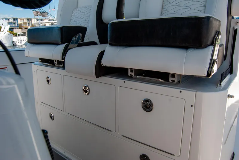 Slide: The Image of 2023 Crevalle 33 CSF boat seating and storage compartments. - 43