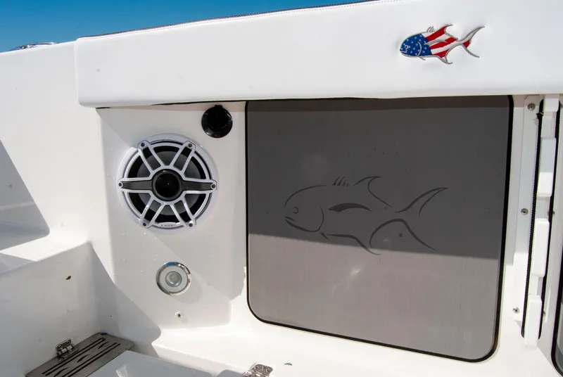 Slide: The Image of 2023 Crevalle 33 CSF boat interior with speaker and fish design detail. - 45