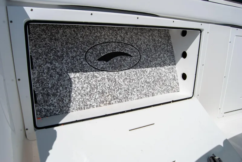 Slide: The Image of 2023 Crevalle 33 CSF boat interior detail with patterned panel and logo. - 46