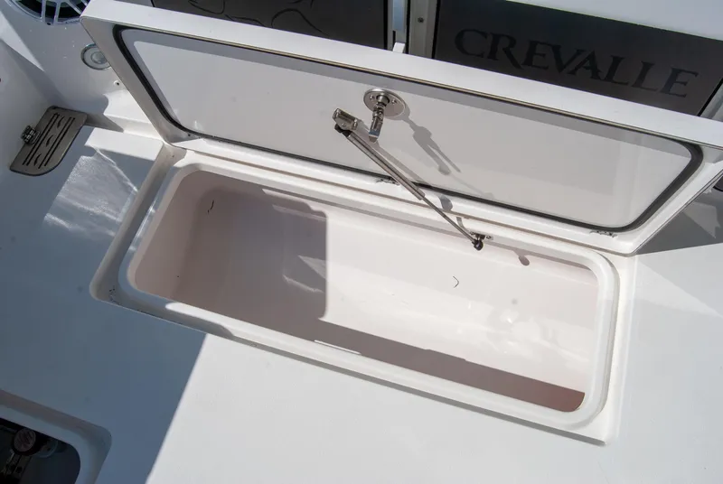 Slide: The Image of Open storage compartment on 2023 Crevalle 33 CSF boat deck. - 47