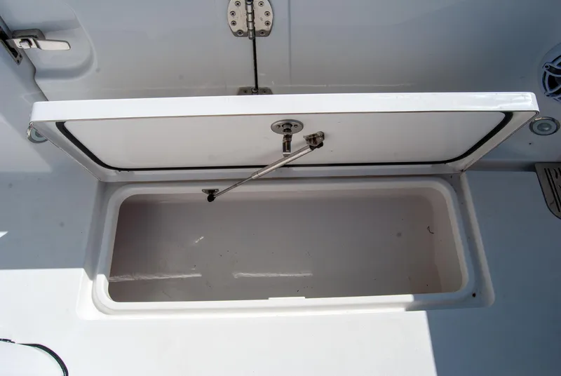 Slide: The Image of Open storage compartment on 2023 Crevalle 33 CSF boat, showcasing interior space. - 49