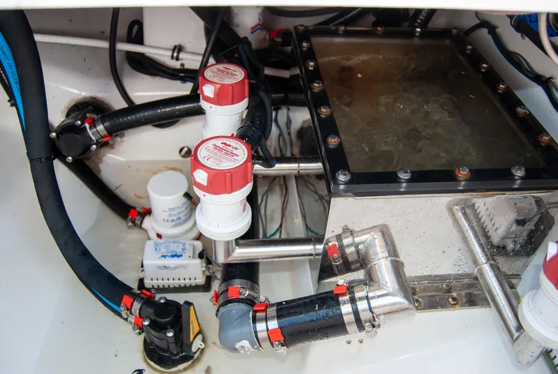 Slide: The Image of Engine compartment of 2023 Crevalle 33 CSF boat, showcasing plumbing and mechanical components. - 51