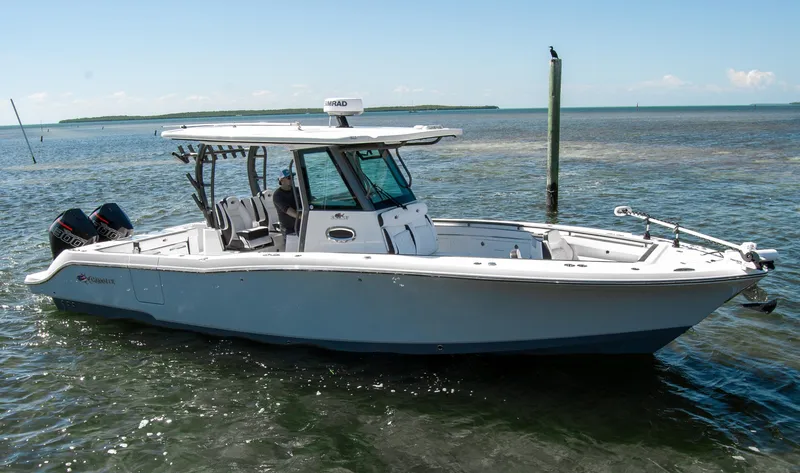 Slide: The Image of 2023 Crevalle 33 CSF boat on calm water, featuring sleek design and modern amenities. - 63