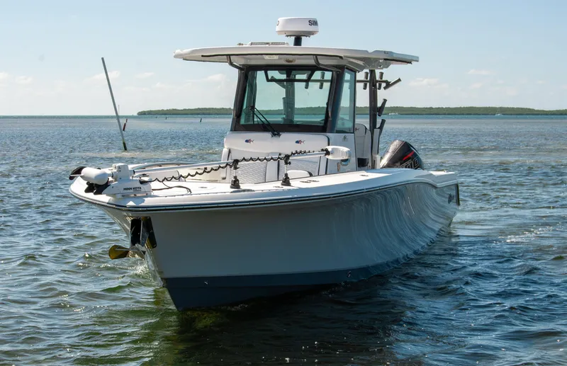 Slide: The Image of 2023 Crevalle 33 CSF boat on calm water, showcasing sleek design and advanced features. - 69