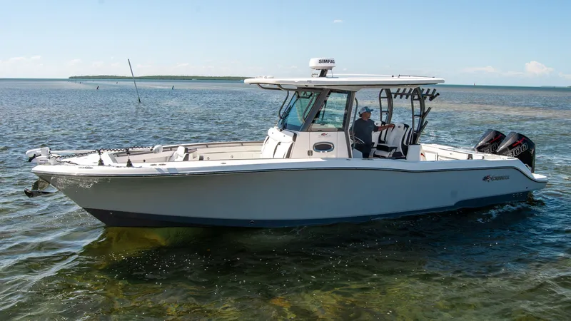 Slide: The Image of 2023 Crevalle 33 CSF boat on clear water, side view, sunny day. - 72